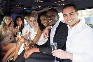 A group of young people drinking in a limo.
