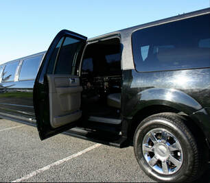 Black stretched limo with the back passenger door open